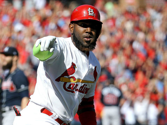 ST LOUIS, MISSOURI - OCTOBER 07: Marcell Ozuna #23 of the St. Louis Cardinals celebrates after hitting a solo home run against the Atlanta Braves during the first inning in game four of the National League Division Series at Busch Stadium on October 07, 2019 in St Louis, Missouri.