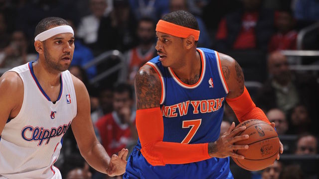 LOS ANGELES, CA - NOVEMBER 27: Carmelo Anthony #7 of the New York Knicks guarded by Jared Dudley #9 of the Los Angeles Clippers in a games against the New York Knicks at Staples Center on November 27, 2013 in Los Angeles, California. NOTE TO USER: User expressly acknowledges and agrees that, by downloading and/or using this Photograph, user is consenting to the terms and conditions of the Getty Images License Agreement. Mandatory Copyright Notice: Copyright 2013 NBAE
