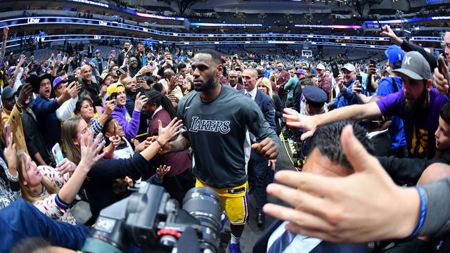 DALLAS, TX - NOVEMBER 1: LeBron James #23 of the Los Angeles Lakers hi-fives fans after the game against the Dallas Mavericks on November 1, 2019 at the American Airlines Center in Dallas, Texas. NOTE TO USER: User expressly acknowledges and agrees that, by downloading and/or using this Photograph, user is consenting to the terms and conditions of the Getty Images License Agreement. Mandatory Copyright Notice: Copyright 2019 NBAE