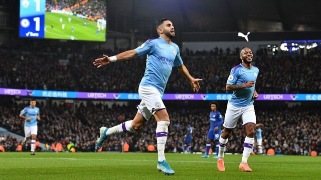 Manchester City's Algerian midfielder Riyad Mahrez (C) celebrates after scoring their second goal during the English Premier League football match between Manchester City and Chelsea at the Etihad Stadium in Manchester, north west England, on November 23, 2019.