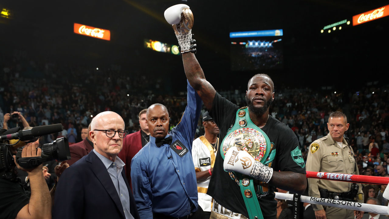 LAS VEGAS, NEVADA - NOVEMBER 23: WBC heavyweight champion Deontay Wilder poses with referee Kenny Bayless after defeating Luis Ortiz in their title fight at MGM Grand Garden Arena on November 23, 2019 in Las Vegas, Nevada. Wilder won with a seventh-round knockout.