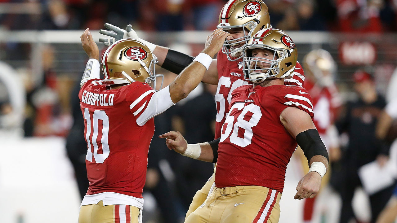SANTA CLARA, CALIFORNIA - NOVEMBER 24: Quarterback Jimmy Garoppolo #10 of the San Francisco 49ers celebrates with Mike Person #68 and Mike McGlinchey #69 after throwing a touchdown pass to George Kittle #85 of the San Francisco 49ers #85 in the third quarter against the Green Bay Packers at Levi's Stadium on November 24, 2019 in Santa Clara, California.