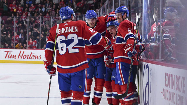 MONTREAL, QC - NOVEMBER 23: Max Domi #13 of the Montreal Canadiens celebrates with teammates after scoring his second goal of the night against the New York Rangers in the NHL game at the Bell Centre on November 23, 2019 in Montreal, Quebec, Canada.