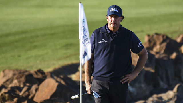 LA QUINTA, CA - JANUARY 19: Phil Mickelson looks at the pin flag as he waits to putt on the 18th hole green during the third round of the Desert Classic on the Stadium Course at PGA West on January 19, 2019 in La Quinta, California.