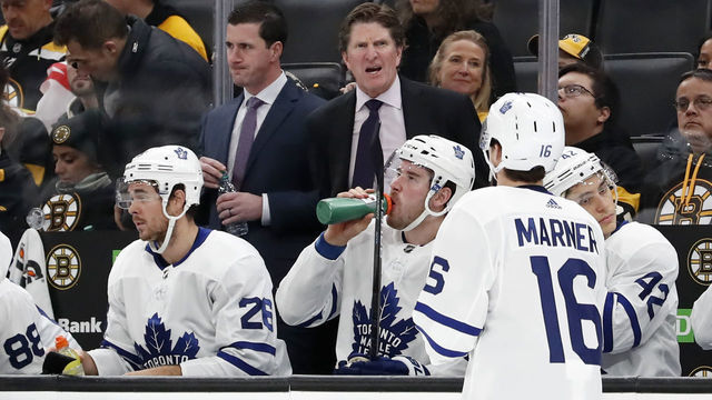 BOSTON, MA - OCTOBER 22: Toronto Maple Leafs head coach Mike Babcock talks to Toronto Maple Leafs right wing Mitchell Marner (16) during a game between the Boston Bruins and the Toronto Maple Leafs on October 22, 2019, at TD Garden in Boston, Massachusetts.
