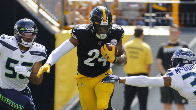 PITTSBURGH, PA - SEPTEMBER 15: Benny Snell #24 of the Pittsburgh Steelers rushes against Bradley McDougald #30 and Mychal Kendricks #56 of the Seattle Seahawks on September 15, 2019 at Heinz Field in Pittsburgh, Pennsylvania.
