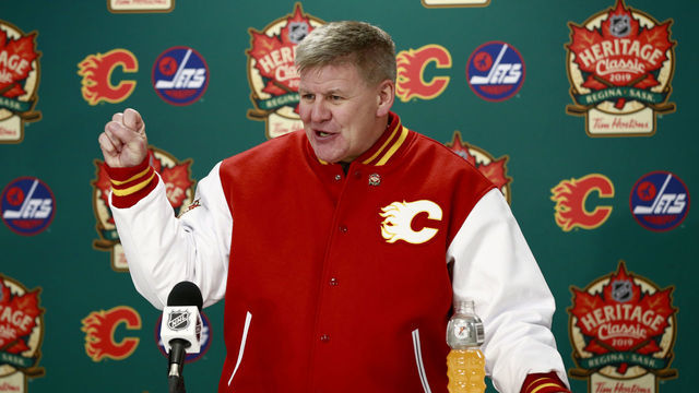 REGINA, SASKATCHEWAN - OCTOBER 26: Head coach Bill Peters of the Calgary Flames speaks at the post game press conference after the 2019 Tim Hortons NHL Heritage Classic between the Calgary Flames and the Winnipeg Jets at Mosaic Stadium on October 26, 2019 in Regina, Canada. The Jets defeated the Flames 2-1 in overtime.