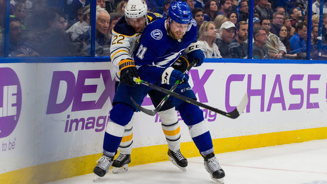TAMPA, FL - NOVEMBER 25: Erik Cernak #81 of the Tampa Bay Lightning skates against Johan Larsson #22 of the Buffalo Sabres during the second period at Amalie Arena on November 25, 2019 in Tampa, Florida.