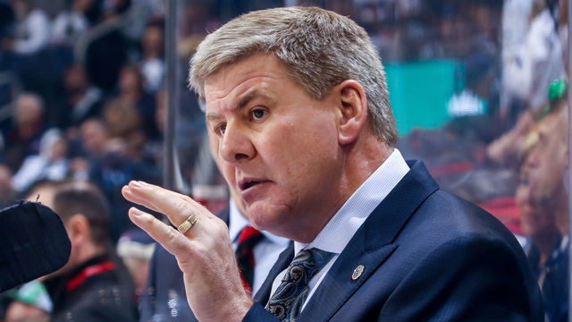 WINNIPEG, MB - MARCH 16: Head Coach Bill Peters of the Calgary Flames looks on from the bench during third period action against the Winnipeg Jets at the Bell MTS Place on March 16, 2019 in Winnipeg, Manitoba, Canada.