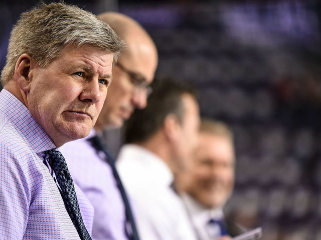 CALGARY, AB - MARCH 15: Head coach for the Calgary Flames Bill Peters watches warm ups before an NHL game where the Calgary Flames hosted the New York Rangers on March 15, 2019, at the Scotiabank Saddledome in Calgary, AB.