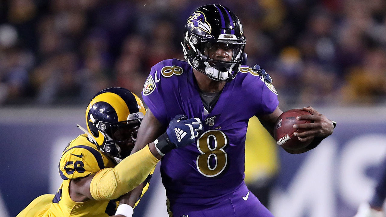 LOS ANGELES, CALIFORNIA - NOVEMBER 25: Dante Fowler Jr. #56 of the Los Angeles Rams chases Lamar Jackson #8 of the Baltimore Ravens during the second half of a game at Los Angeles Memorial Coliseum on November 25, 2019 in Los Angeles, California.