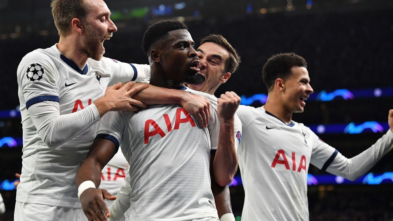 Tottenham Hotspur's Ivorian defender Serge Aurier (2L) celebrates scoring his team's third goal during the UEFA Champions League Group B football match between Tottenham Hotspur and Olympiakos at the Tottenham Hotspur Stadium in north London, on November 26, 2019.