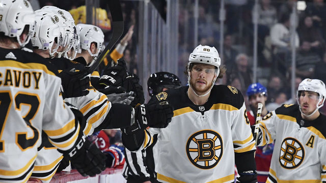 MONTREAL, QC - NOVEMBER 26: David Pastrnak #88 of the Boston Bruins celebrates with the bench after scoring a goal against the Montreal Canadiens in the NHL game at the Bell Centre on November 26, 2019 in Montreal, Quebec, Canada.