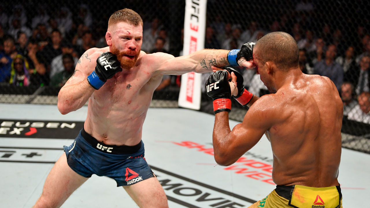 ABU DHABI, UNITED ARAB EMIRATES - SEPTEMBER 07: (L-R) Paul Felder punches Edson Barboza of Brazil in their lightweight bout during UFC 242 at The Arena on September 7, 2019 in Yas Island, Abu Dhabi, United Arab Emirates.