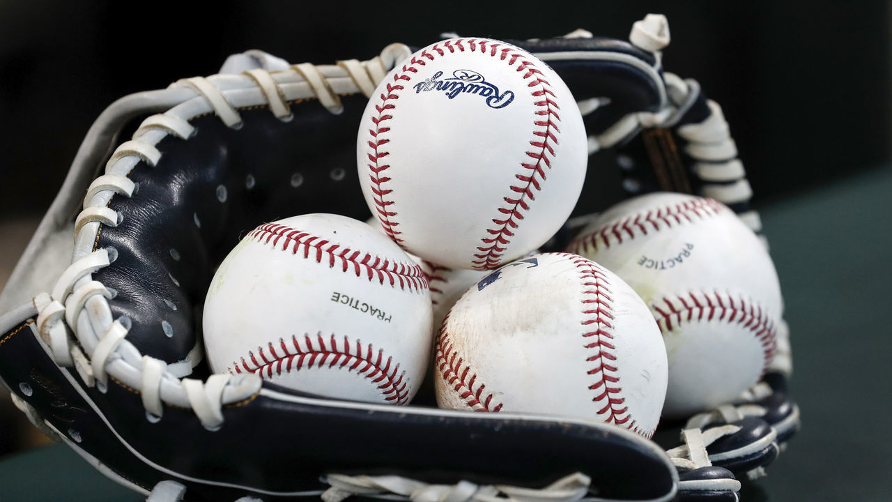 HOUSTON, TX - OCTOBER 10: A glove and baseballs is seen before the game between the Houston Astros and the Tampa Bay Rays at Minute Maid Park on October 10, 2019 in Houston, Texas.
