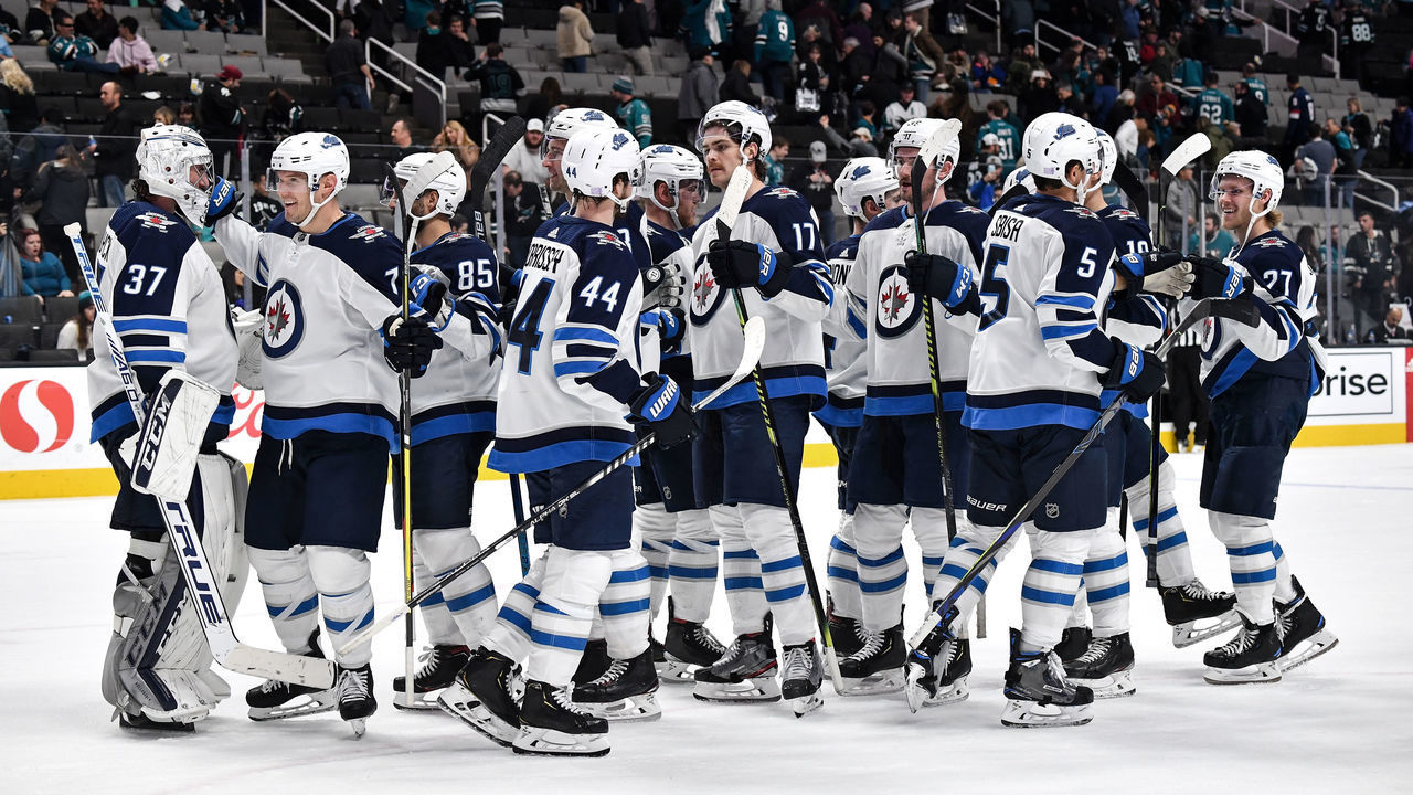 SAN JOSE, CA - NOVEMBER 27: The Winnipeg Jets celebrate the win against the San Jose Sharks at SAP Center on November 27, 2019 in San Jose, California.