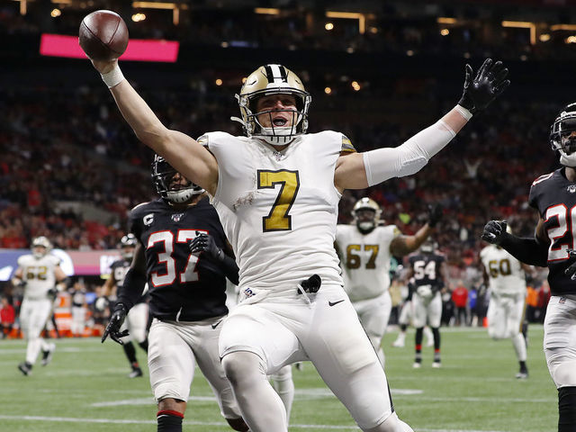 ATLANTA, GEORGIA - NOVEMBER 28: Taysom Hill #7 of the New Orleans Saints celebrates as he scores on a 30-yard touchdown run during the second quarter against the Atlanta Falcons at Mercedes-Benz Stadium on November 28, 2019 in Atlanta, Georgia.