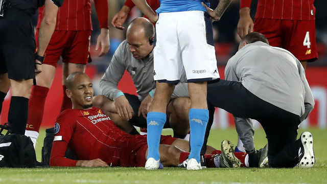 Liverpool's Fabinho receives medical attention during the UEFA Champions League Group E match at Anfield, Liverpool.