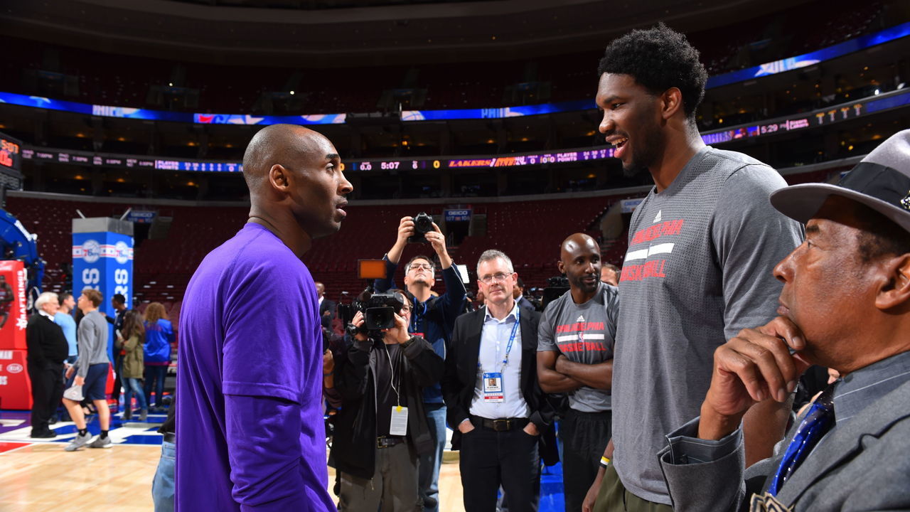 PHILADELPHIA,PA - DECEMBER 1: Joel Embiid #21 of the Philadelphia 76ers speaks with Kobe Bryant #24 of the Los Angeles Lakers at Wells Fargo Center on December 1, 2015 in Philadelphia, Pennsylvania NOTE TO USER: User expressly acknowledges and agrees that, by downloading and/or using this Photograph, user is consenting to the terms and conditions of the Getty Images License Agreement. Mandatory Copyright Notice: Copyright 2015 NBAE