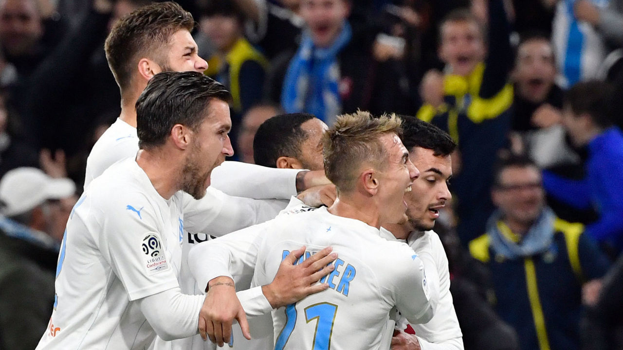 Marseille's Serbian forward Nemanja Radonjic (R, back) is congratulated by his teammates after scoring a second goal during the French L1 football match between Olympique de Marseille (OM) and Brest at the Orange Velodrome stadium in Marseille, southeastern France, on November 29, 2019.