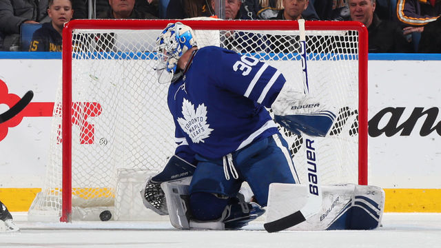 BUFFALO, NY - NOVEMBER 29: Casey Mittelstadt #37 of the Buffalo Sabres (not shown) scores a goal against Michael Hutchinson #30 of the Toronto Maple Leafs during the second period of an NHL game on November 29, 2019 at KeyBank Center in Buffalo, New York.