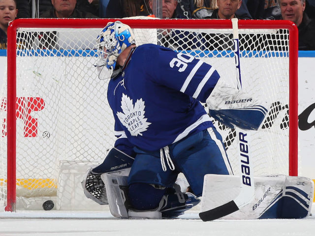 BUFFALO, NY - NOVEMBER 29: Casey Mittelstadt #37 of the Buffalo Sabres (not shown) scores a goal against Michael Hutchinson #30 of the Toronto Maple Leafs during the second period of an NHL game on November 29, 2019 at KeyBank Center in Buffalo, New York.