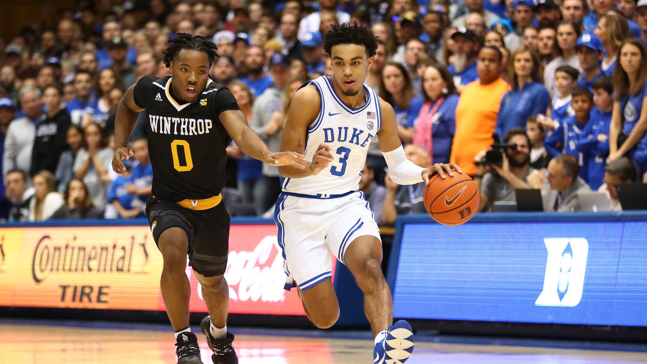 DURHAM, NC - NOVEMBER 29: Duke Blue Devils guard Tre Jones (3) with the ball guarded by Winthrop Eagles guard Russell Jones (0) during the 1st half of the Duke Blue Devils game versus the Winthrop Eagles on November 29th, 2019 at Cameron Indoor Stadium in Durham, NC.
