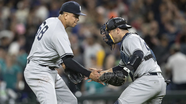 SEATTLE, WA - SEPTEMBER 8: Relief pitcher Dellin Betances #68 of the New York Yankees and catcher Austin Romine #28 of the New York Yankees celebrate after a game against the Seattle Mariners at Safeco Field on September 8, 2018 in Seattle, Washington. The Yankees won 4-2.