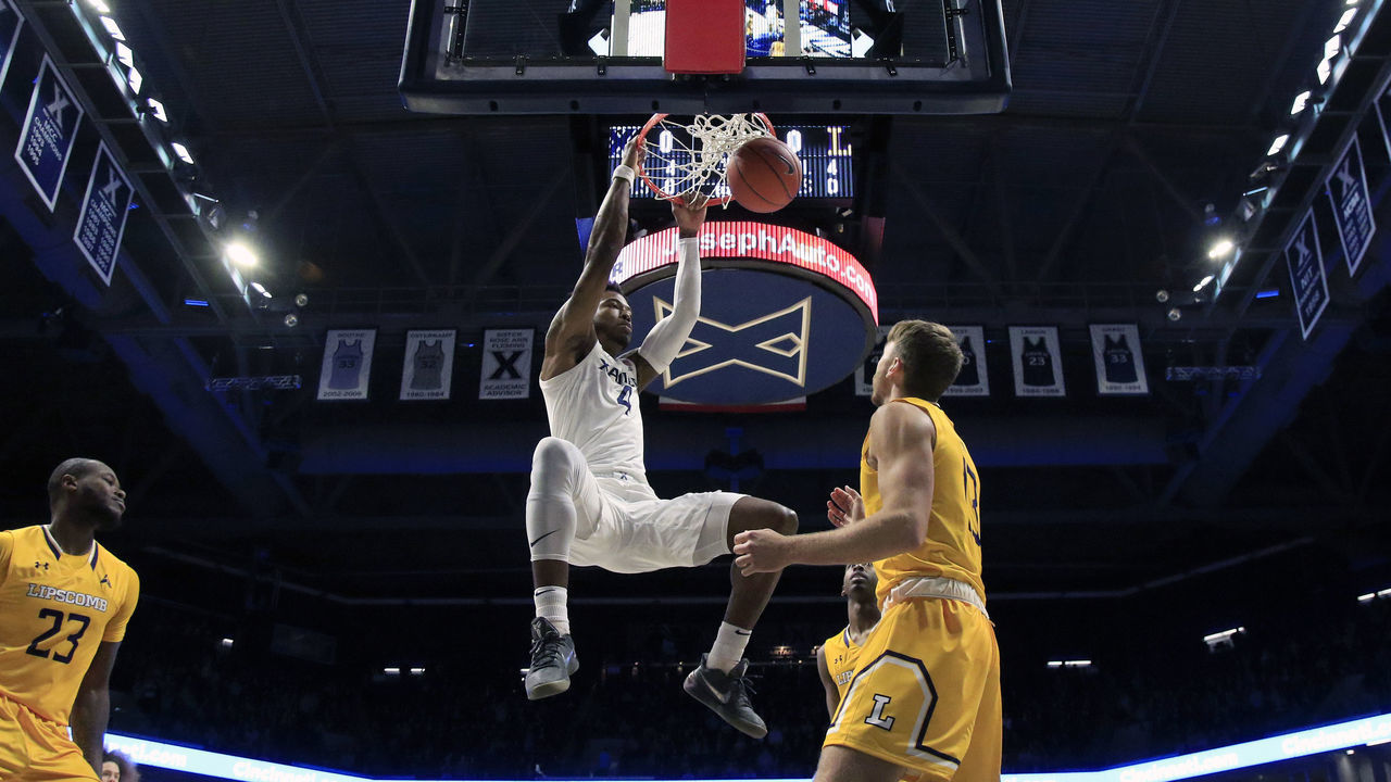 CINCINNATI, OHIO - NOVEMBER 30: Tyrique Jones #4 of the Xavier Musketeers dunks the ball against the Lipscomb Bisons in the first half at Cintas Center on November 30, 2019 in Cincinnati, Ohio.