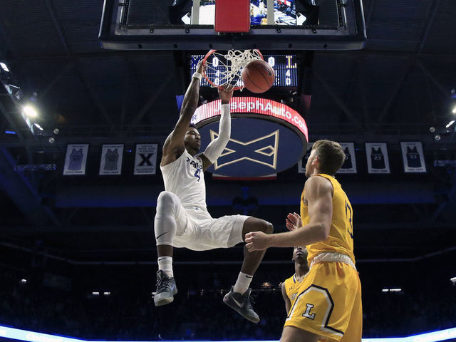 CINCINNATI, OHIO - NOVEMBER 30: Tyrique Jones #4 of the Xavier Musketeers dunks the ball against the Lipscomb Bisons in the first half at Cintas Center on November 30, 2019 in Cincinnati, Ohio.