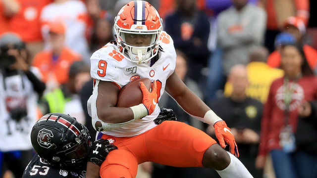 COLUMBIA, SOUTH CAROLINA - NOVEMBER 30: Ernest Jones #53 of the South Carolina Gamecocks tries to stop Travis Etienne #9 of the Clemson Tigers during their game at Williams-Brice Stadium on November 30, 2019 in Columbia, South Carolina.