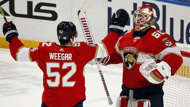 SUNRISE, FL - NOVEMBER 30: Goaltender Chris Driedger #60 of the Florida Panthers celebrates with teammate MacKenzie Weegar #52 his 3-0 shut out win against the Nashville Predators at the BB&T Center on November 30, 2019 in Sunrise, Florida.