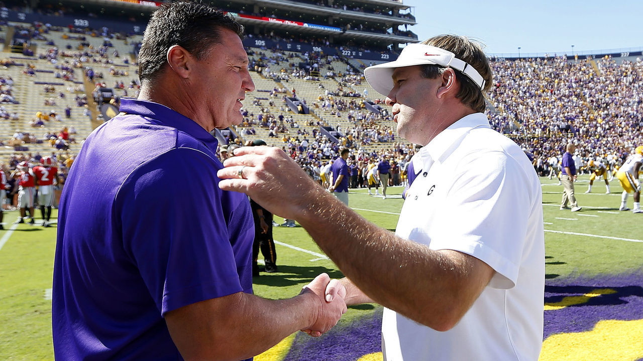 BATON ROUGE, LA - OCTOBER 13: Head coach Ed Orgeron (L) of the LSU Tigers and head coach Kirby Smart of the Georgia Bulldogs meet on the field before a game at Tiger Stadium on October 13, 2018 in Baton Rouge, Louisiana.