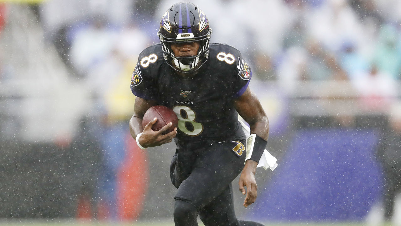 BALTIMORE, MARYLAND - DECEMBER 01: Lamar Jackson #8 of the Baltimore Ravens runs with the ball during the first half against the San Francisco 49ers at M&T Bank Stadium on December 01, 2019 in Baltimore, Maryland.