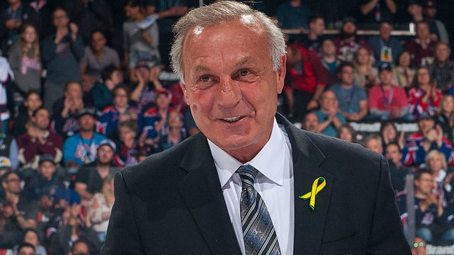REGINA, SK - MAY 25: NHL alumni Guy Lafleur, stands next to Ron Hitchcock of the Royal Canadian Legion for the ceremonial puck drop between the Regina Pats and the Hamilton Bulldogs at Brandt Centre - Evraz Place on May 25, 2018 in Regina, Canada.