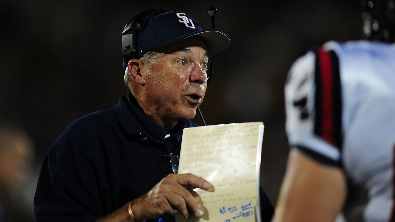 ORLANDO, FL - SEPTEMBER 05: Pat Sullivan, head coach of the Samford Bulldogs, talks to his players during the game against University of Central Florida Knights, at Bright House Networks Stadium on September 5, 2009 in Orlando, Florida
