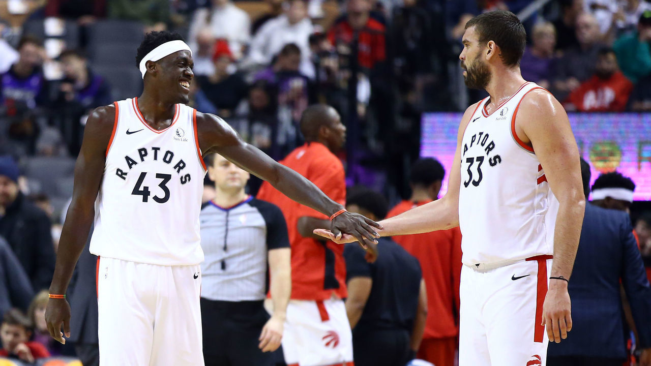 TORONTO, ON - DECEMBER 01: Pascal Siakam #43 of the Toronto Raptors slaps hands with Marc Gasol #33 during the first half of an NBA game against the Utah Jazz at Scotiabank Arena on December 01, 2019 in Toronto, Canada.
