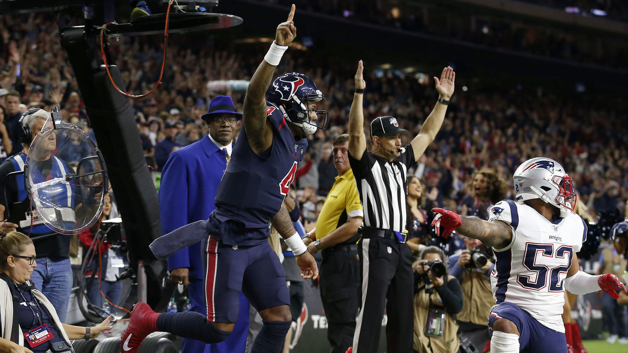 HOUSTON, TEXAS - DECEMBER 01: Deshaun Watson #4 of the Houston Texans celebrates after scoring a touchdown against Elandon Roberts #52 of the New England Patriots during the fourth quarter in the game at NRG Stadium on December 01, 2019 in Houston, Texas.