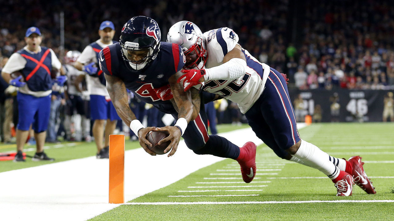 HOUSTON, TEXAS - DECEMBER 01: Deshaun Watson #4 of the Houston Texans scores a touchdown against Elandon Roberts #52 of the New England Patriots during the fourth quarter in the game at NRG Stadium on December 01, 2019 in Houston, Texas.