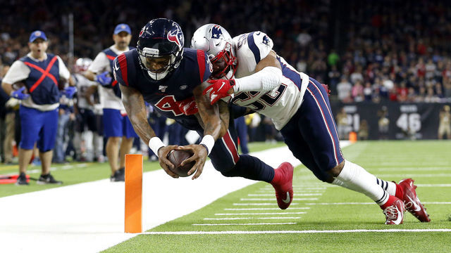 HOUSTON, TEXAS - DECEMBER 01: Deshaun Watson #4 of the Houston Texans scores a touchdown against Elandon Roberts #52 of the New England Patriots during the fourth quarter in the game at NRG Stadium on December 01, 2019 in Houston, Texas.