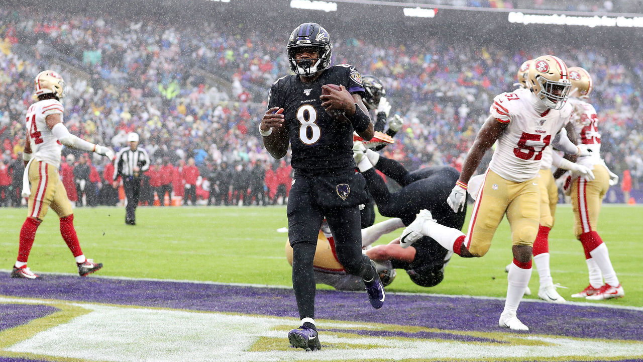 BALTIMORE, MARYLAND - DECEMBER 01: Lamar Jackson #8 of the Baltimore Ravens rushes for a 1-yard touchdown during the second quarter against the San Francisco 49ers at M&T Bank Stadium on December 01, 2019 in Baltimore, Maryland.