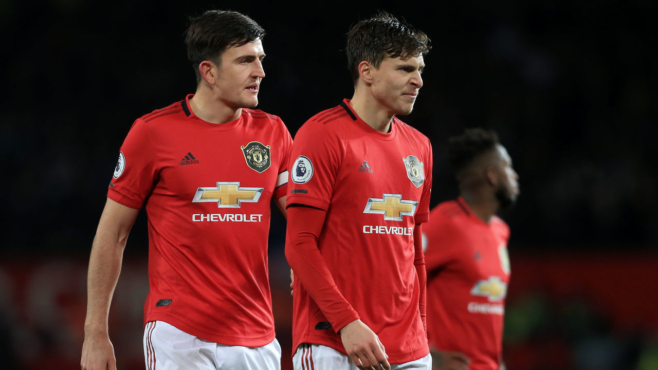 MANCHESTER, ENGLAND - DECEMBER 01: Harry Maguire of Man Utd (L) and Victor Lindelof of Man Utd look dejected during the Premier League match between Manchester United and Aston Villa at Old Trafford on December 1, 2019 in Manchester, United Kingdom.