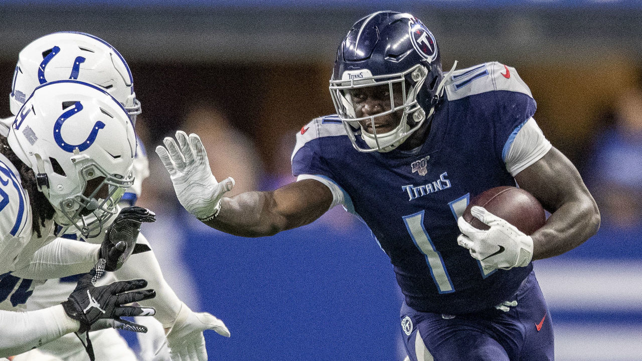 INDIANAPOLIS, IN - DECEMBER 01: A.J. Brown #11 of the Tennessee Titans stiff arms Malik Hooker #29 of the Indianapolis Colts after making a catch in the third quarter of the game against the Indianapolis Colts at Lucas Oil Stadium on December 1, 2019 in Indianapolis, Indiana.