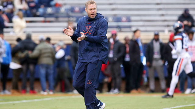 CHARLOTTESVILLE, VA - NOVEMBER 23: Head coach Bronco Mendenhall of the Virginia Cavaliers watches his team warm up before the start of a game against the Liberty Flames at Scott Stadium on November 23, 2019 in Charlottesville, Virginia.