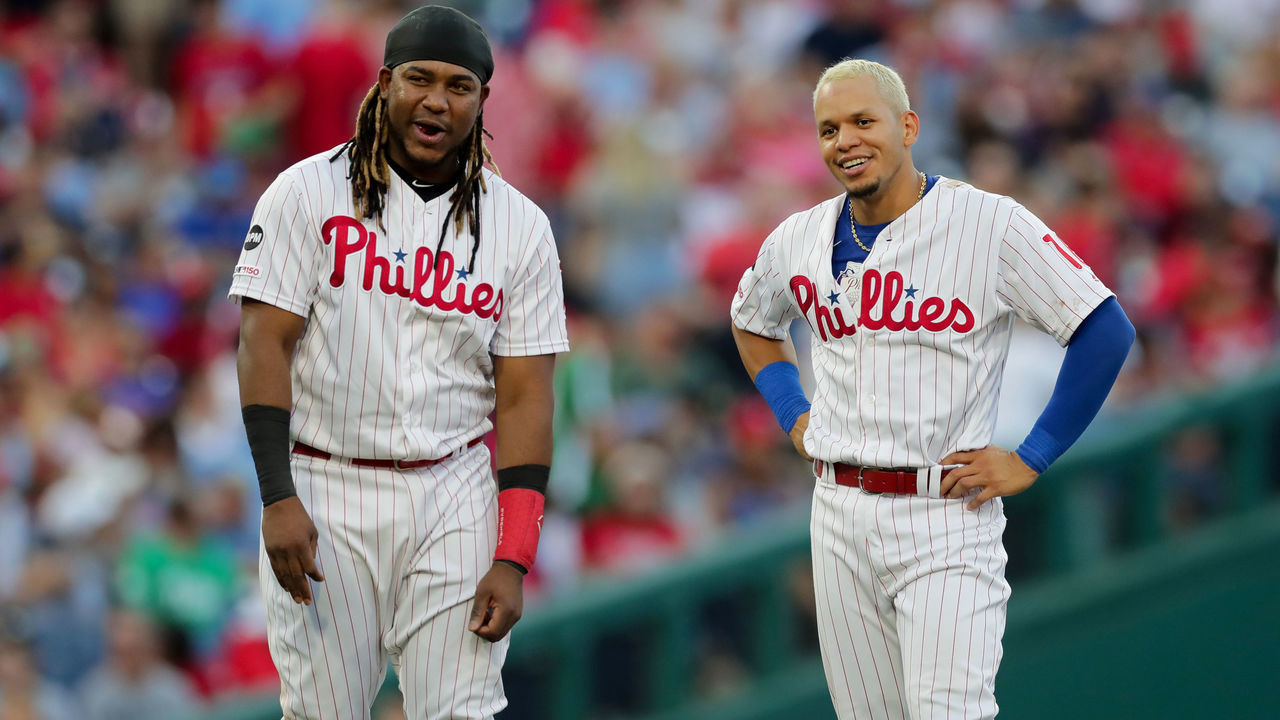 PHILADELPHIA, PA - JULY 12: Maikel Franco #7 and Cesar Hernandez #16 of the Philadelphia Phillies smile during a game against the Washington Nationals at Citizens Bank Park on July 12, 2019 in Philadelphia, Pennsylvania. The Nationals won 4-0.