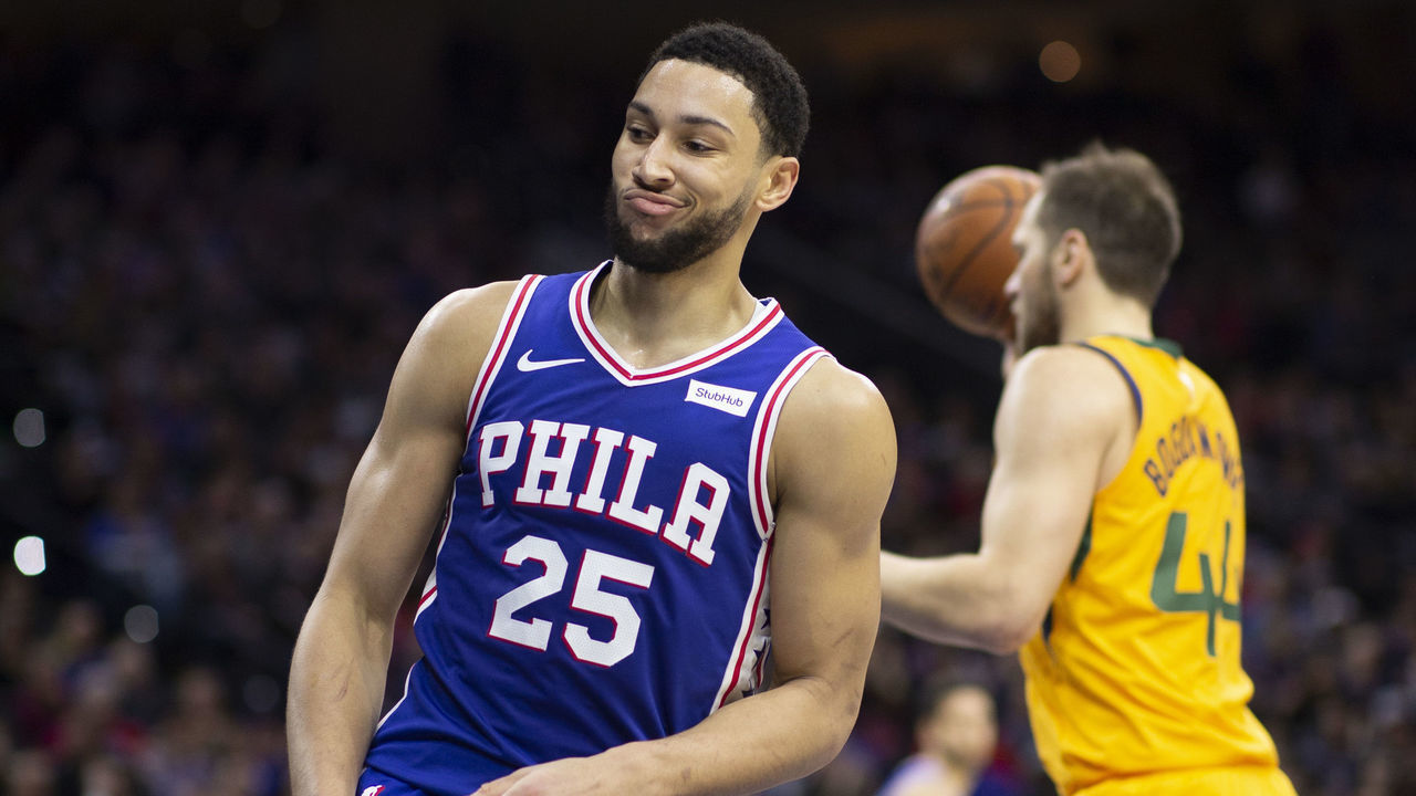 PHILADELPHIA, PA - DECEMBER 02: Ben Simmons #25 of the Philadelphia 76ers reacts in front of Bojan Bogdanovic #44 of the Utah Jazz in the third quarter at the Wells Fargo Center on December 2, 2019 in Philadelphia, Pennsylvania. The 76ers defeated the Jazz 103-94. NOTE TO USER: User expressly acknowledges and agrees that, by downloading and/or using this photograph, user is consenting to the terms and conditions of the Getty Images License Agreement.