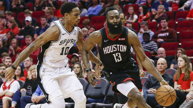 HOUSTON, TEXAS - DECEMBER 22: James Harden #13 of the Houston Rockets drives around DeMar DeRozan #10 of the San Antonio Spurs during the fourth quarter at Toyota Center on December 22, 2018 in Houston, Texas.