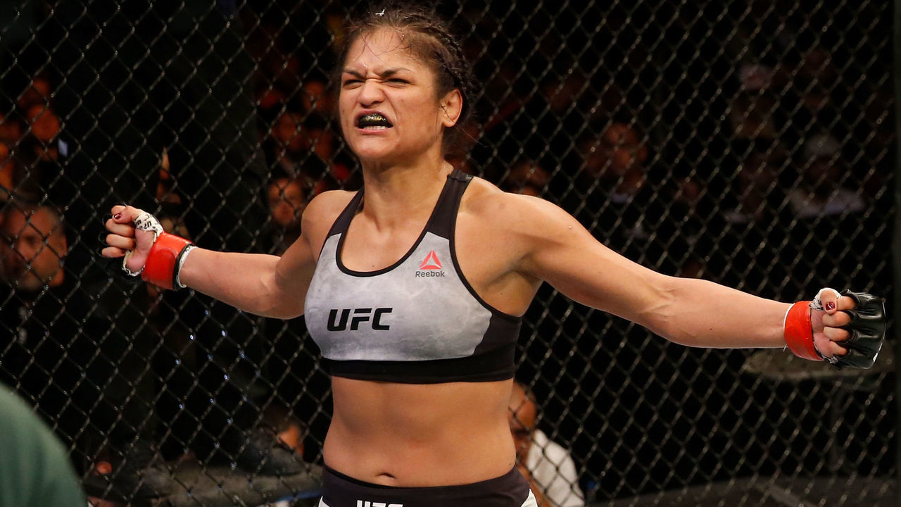 BUENOS AIRES, ARGENTINA - NOVEMBER 17: (R-L) Cynthia Calvillo celebrates after defeating Poliana Botelho of Brazil in their women's strawweight bout during the UFC Fight Night event inside Arena Parque Roca on November 17, 2018 in Buenos Aires, Argentina.