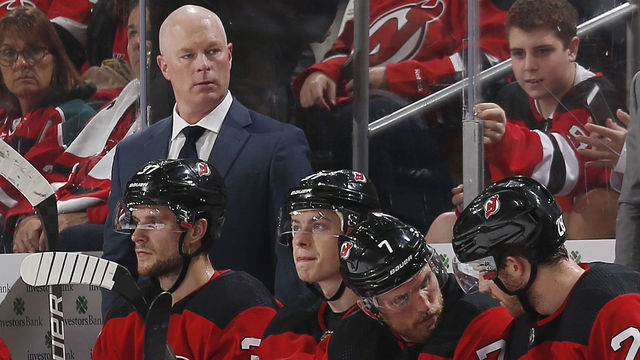 NEWARK,NJ - OCTOBER 25: Head Coach John Hynes of the New Jersey Devils looks on from behind the bench during the game against the Arizona Coyotes at the Prudential Center on October 25, 2019 in Newark, New Jersey.