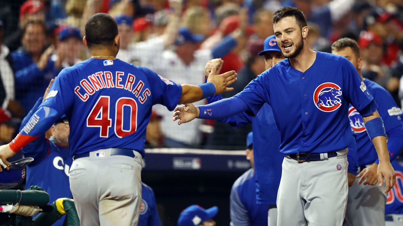 WASHINGTON, D.C. - OCTOBER 12: Willson Contreras #40 celebrates with Kris Bryant #17 of the Chicago Cubs after scoring during Game 5 of the National League Division Series against the Washington Nationals at Nationals Park on Thursday, October 12, 2017 in Washington, D.C.